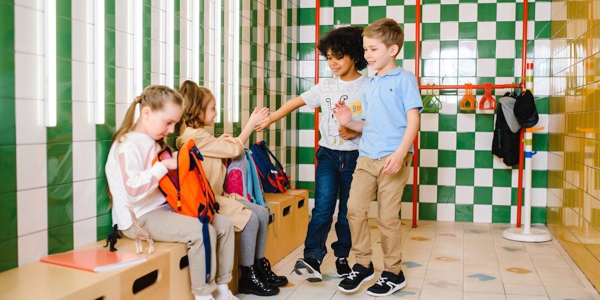 Kids interacting in a school locker room, showcasing friendship and happiness.